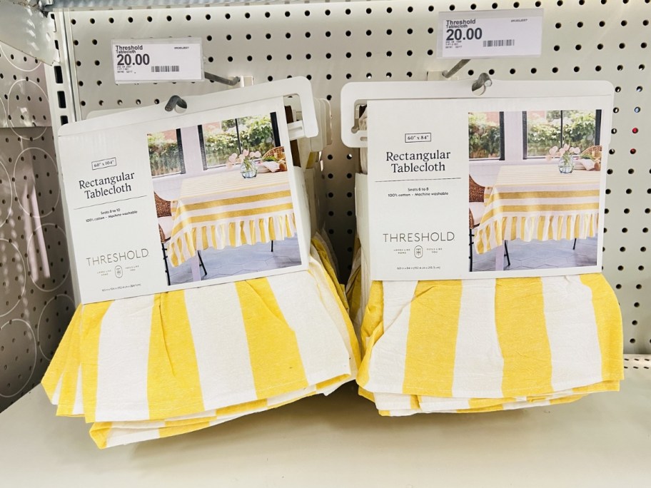 Threshold Yellow Tablecloth hanging in store