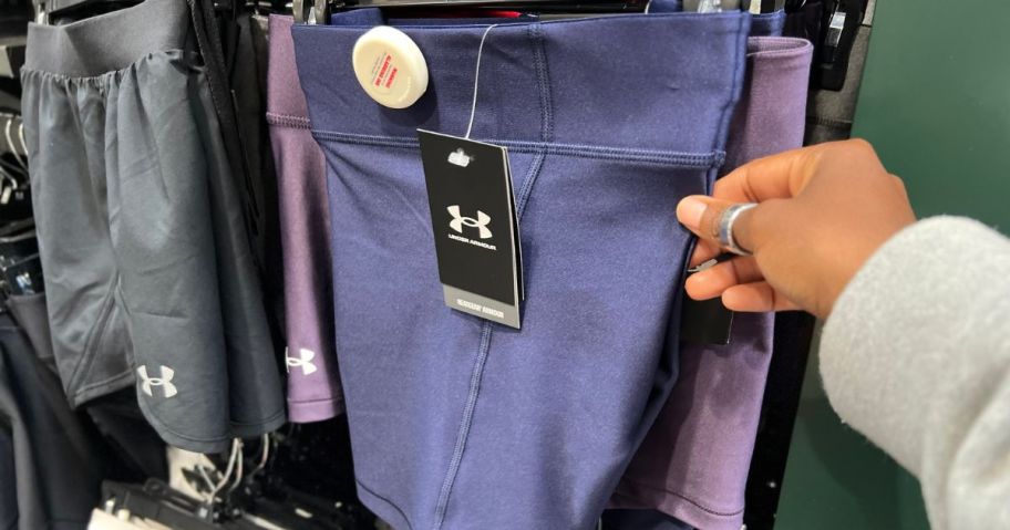 Touch the Under Armour shorts that touch your hands and with the tag