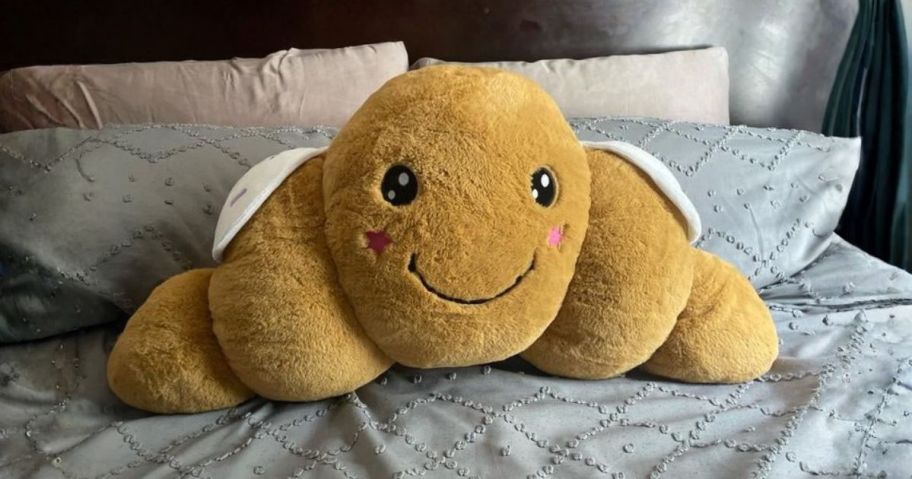 Your Zone Croissant Shaped Plush Body Pillow on bed
