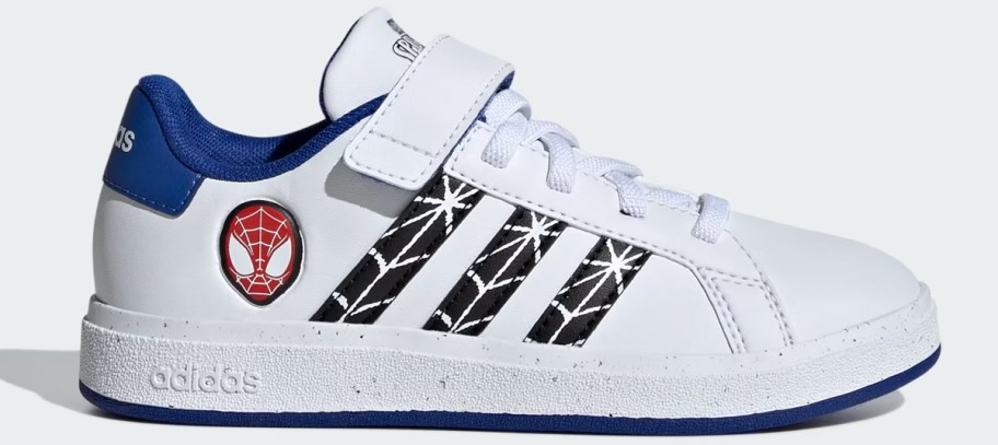 white, black, and blue adidas sneaker with spiderman head