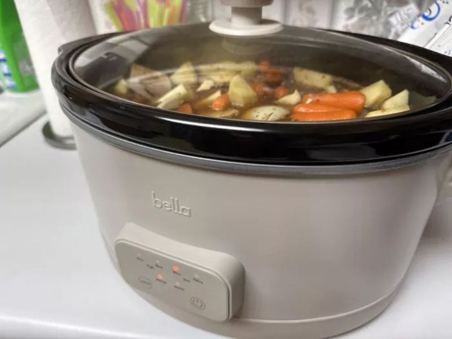 bella slow cooker on counter with stew in it