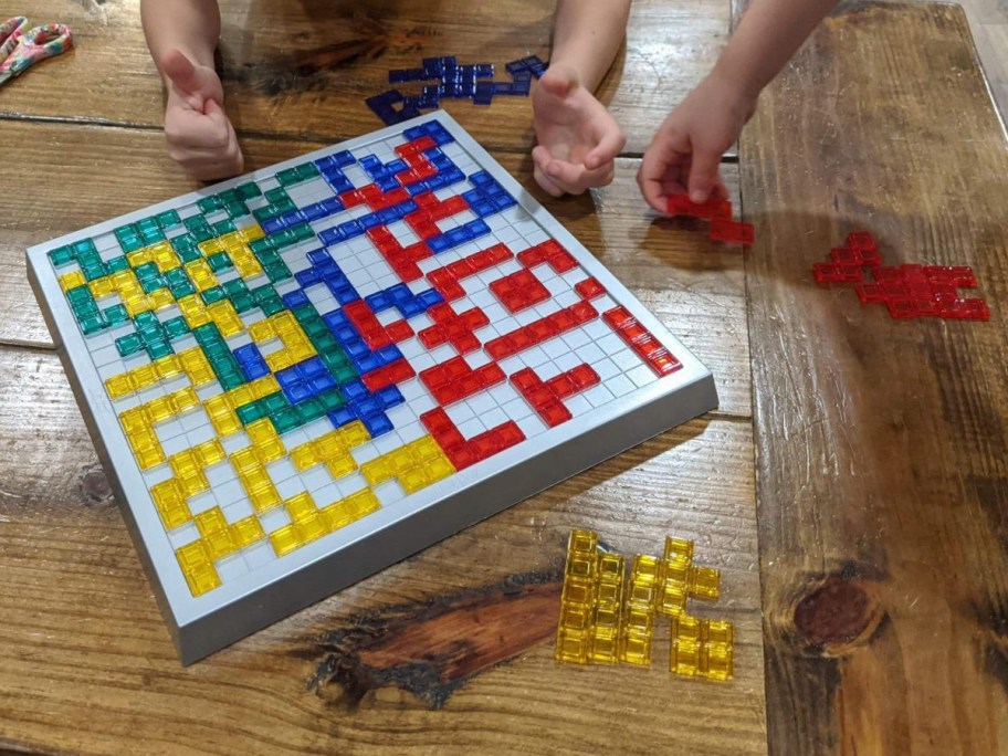 Blokus game on wooden coffee table