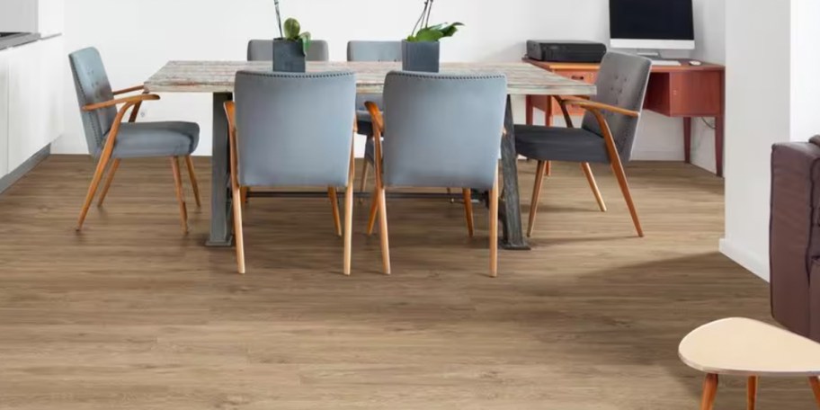 gray kitchen and wood kitchen table on light wood flooring 