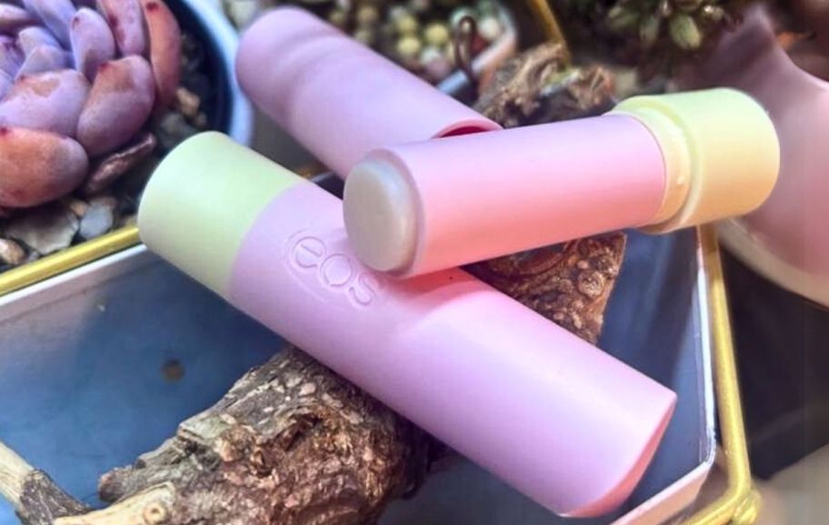 two tubes of eos lip balm stacked with one tube opened