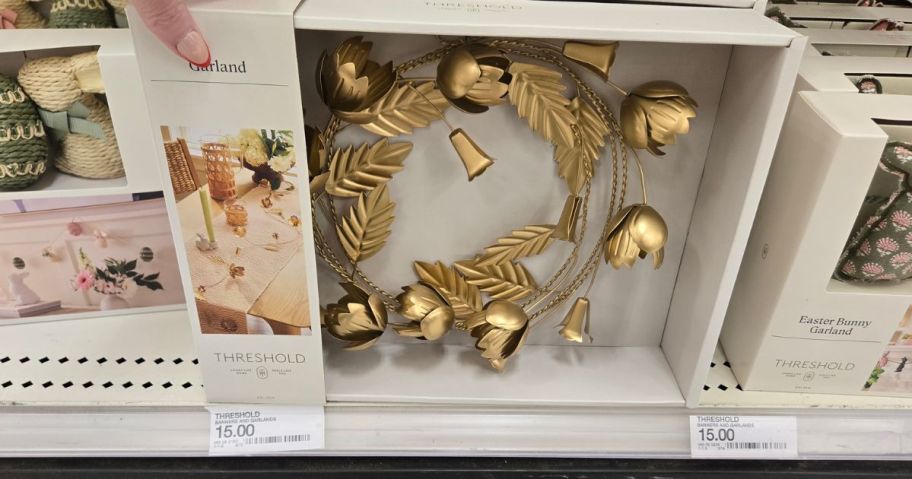 gold garland in its box displayed on the store 