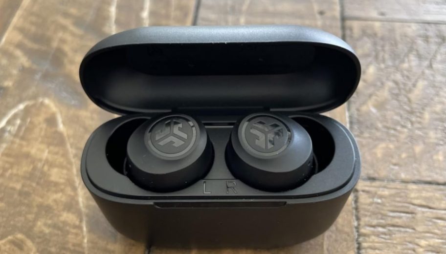 a pair of j labs earbuds in the charging case