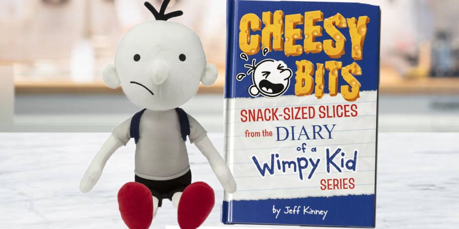 diary of a wimpy kid plush and book on counter