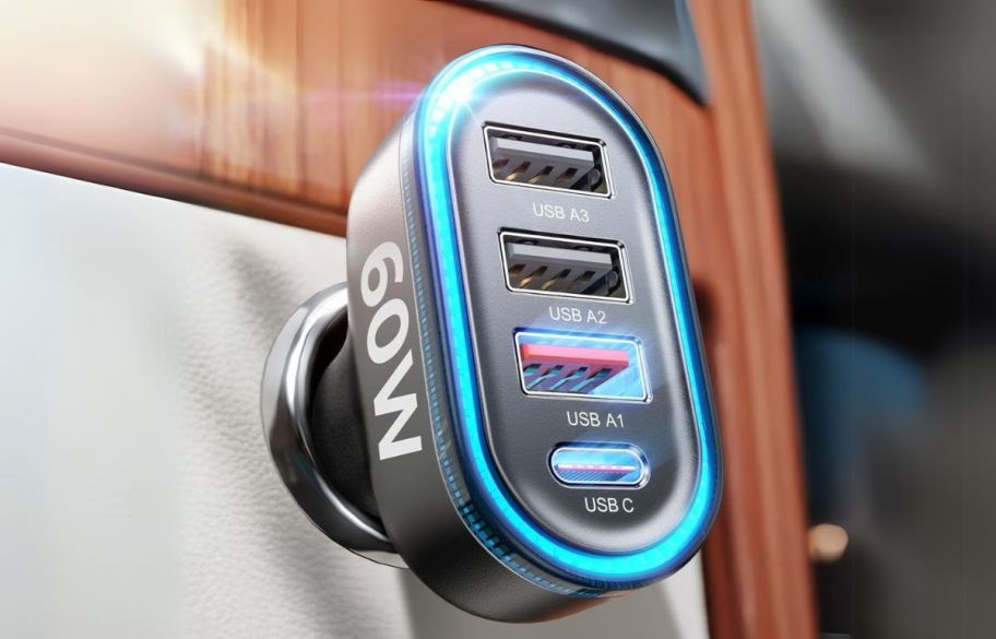 a close up of a USB car charger plugged into an outlet in a vehicle