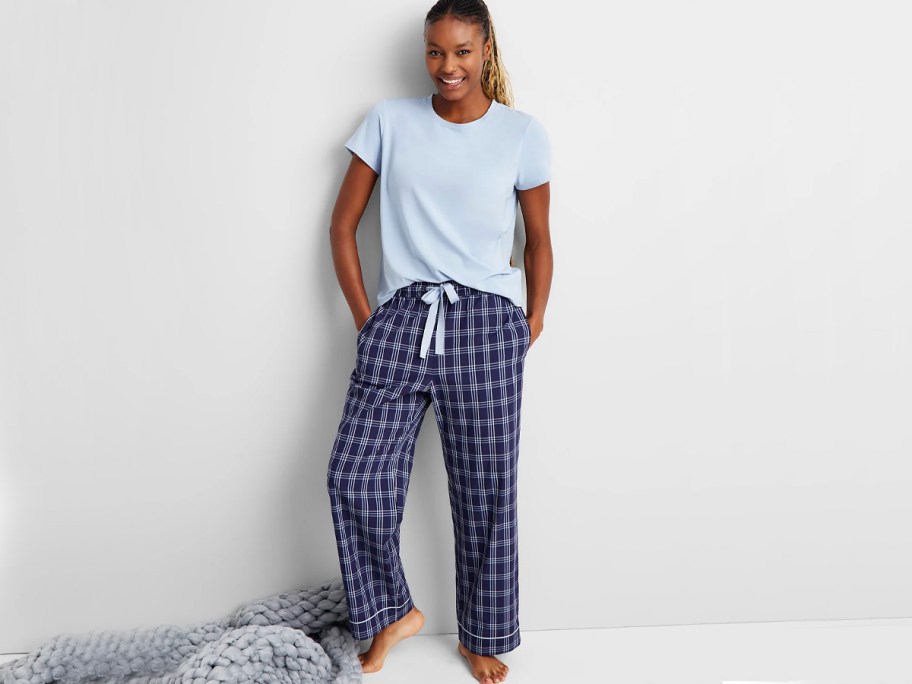 woman wearing blue top and blue pajama pants