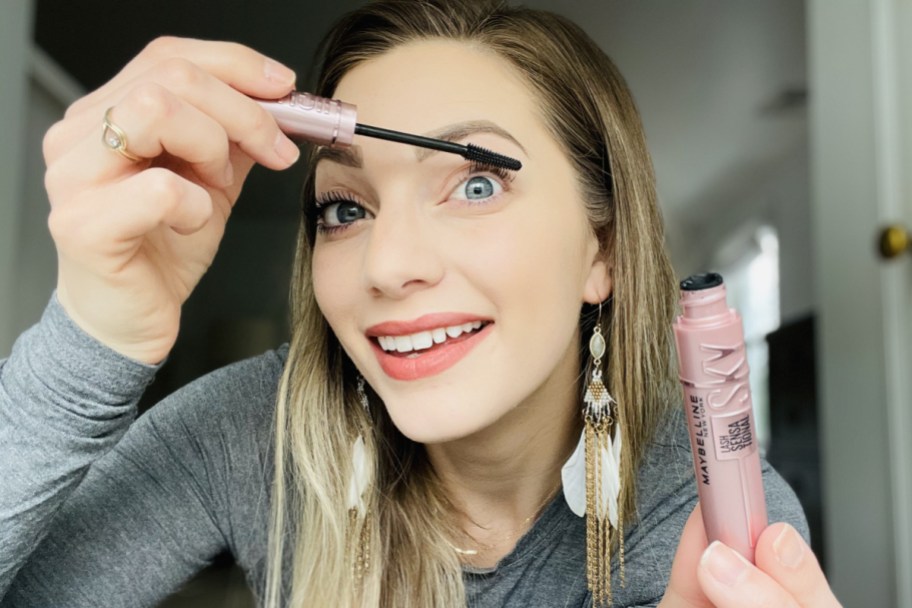 woman applying mascara