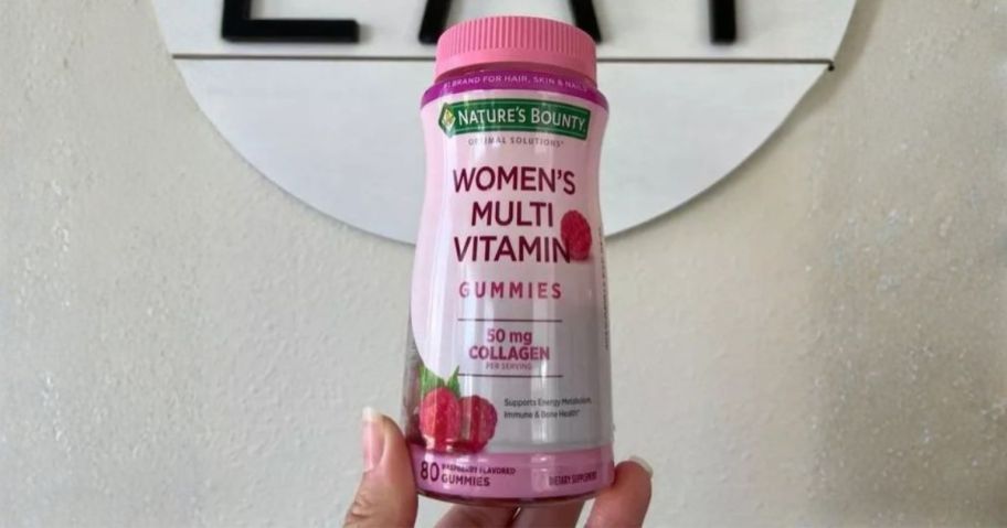 Nature's Bounty Women's Multivitamin 80-Count bottle in hand