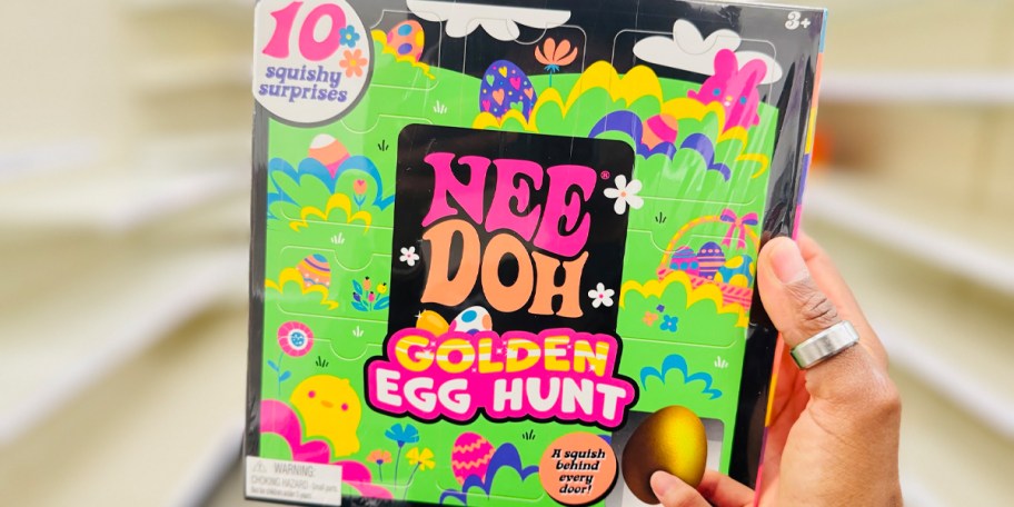 hand holding nee doh golden egg hunt box 