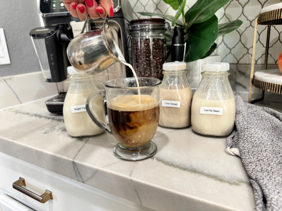 pouring homemade coffee creamer into hot coffee