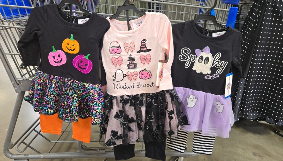 halloween tutu outfits hanging on shopping cart 