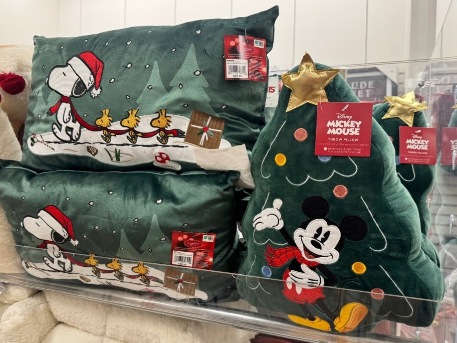snoopy and woodstock velvet throw pillow and a mickey mouse christmas tree shaped throw pillow