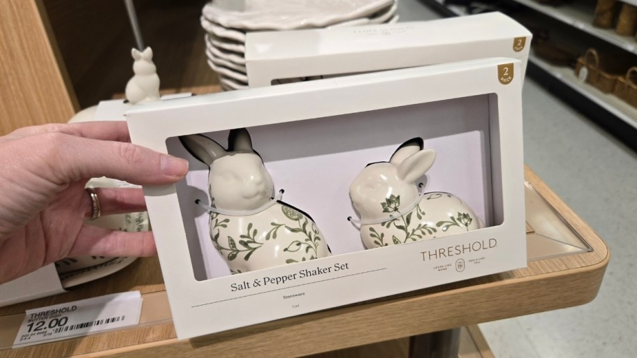 womans hand holding a bunny 2-piece salt and pepper set