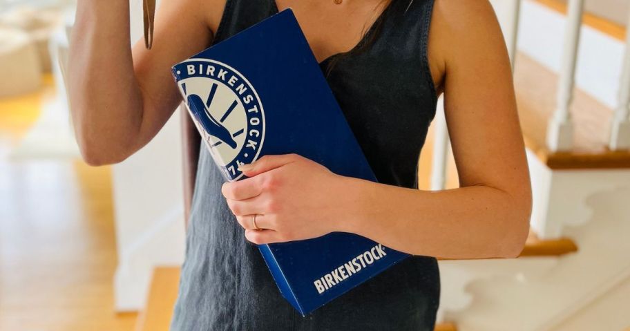 Woman holding a Birkenstock Box