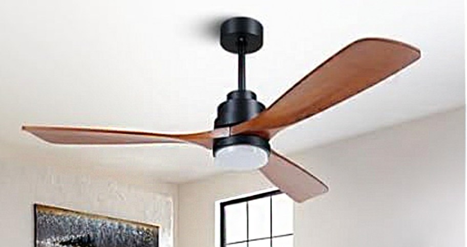 brown and black ceiling fan hanging in room 