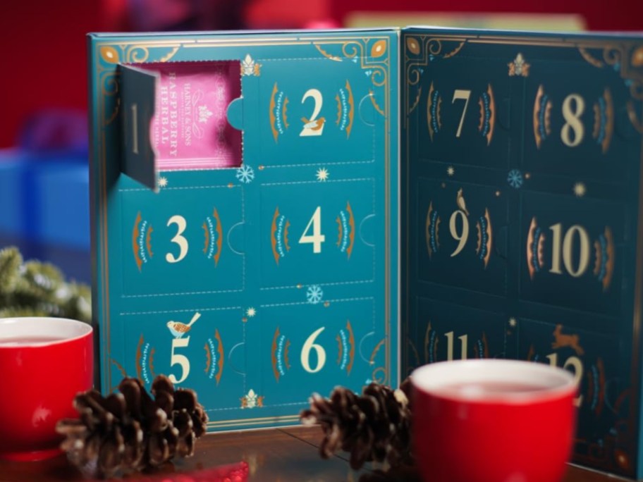 the inside of a a Harney & Sons 12 Days of Tea Countdown Calendar box with one of the days open showing the tea bags