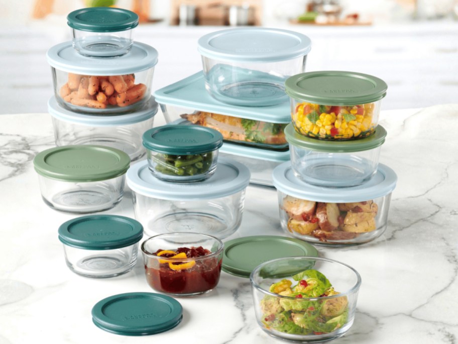 large collection of glass food storage with colorful lids