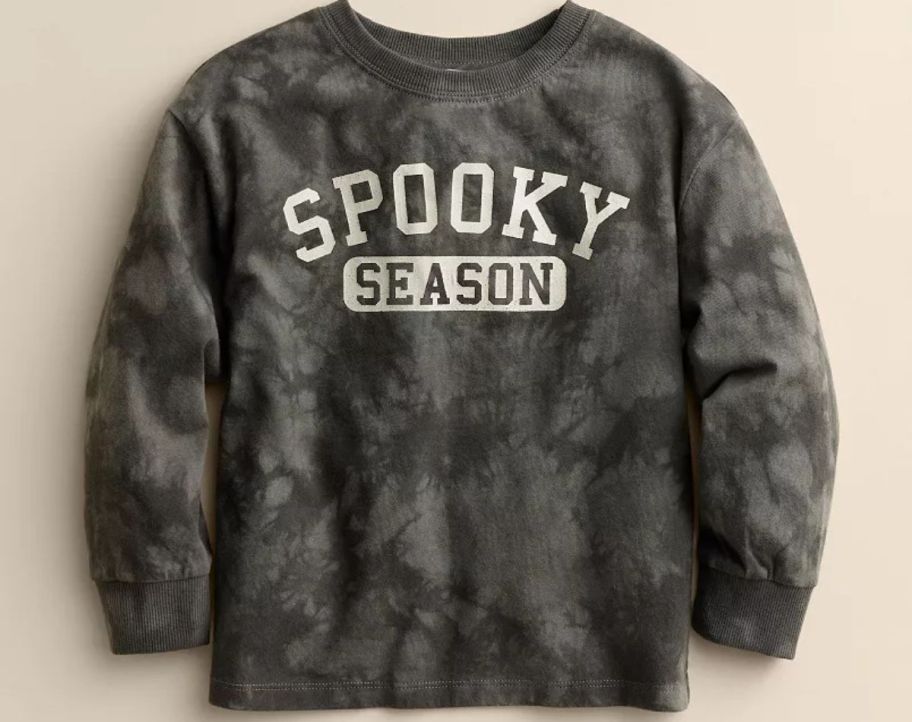 A gray toddler's shirt with the words 'Spooky Season" written on it