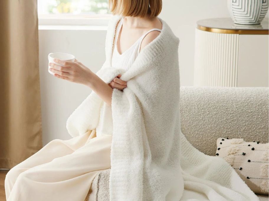 Woman wearing a Bedsure Knit Blanket