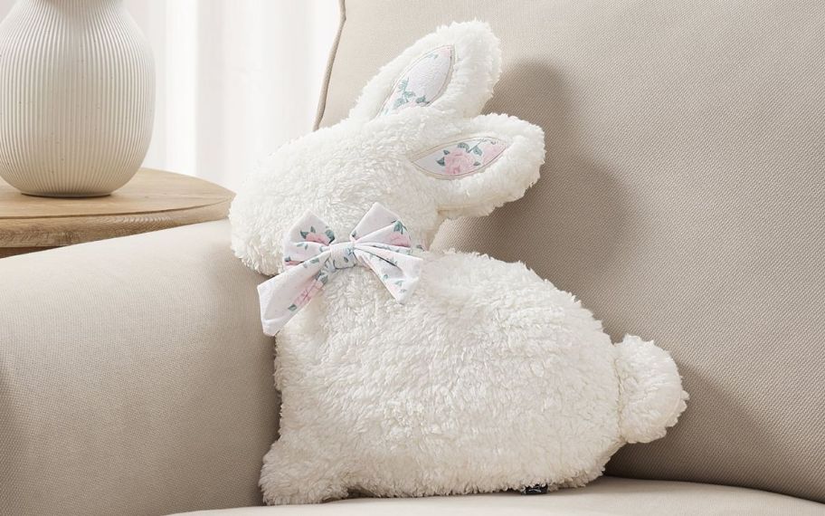 Bunny throw pillow on top of a couch