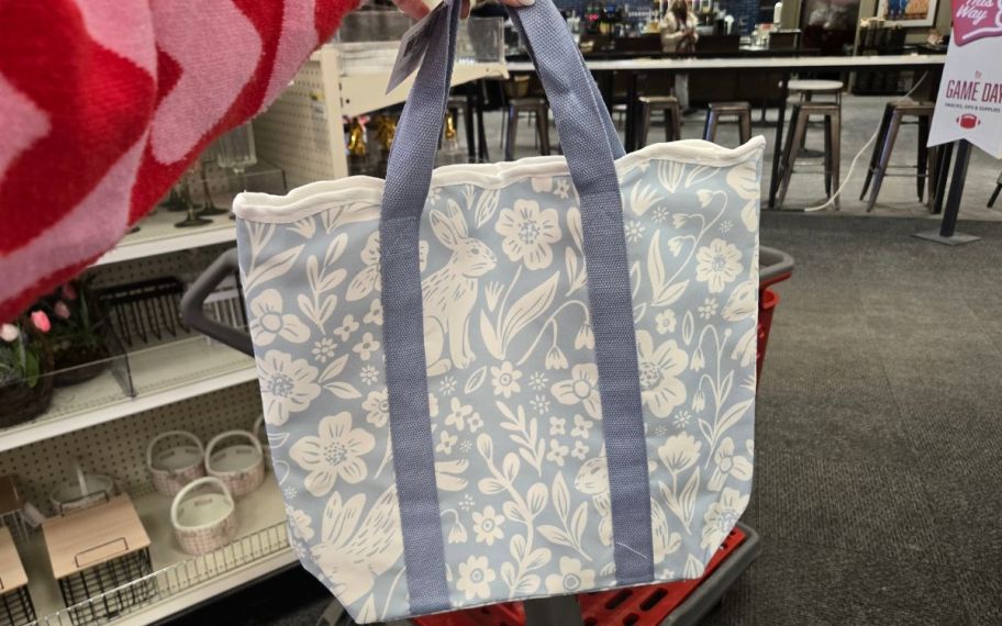 hand holding blue bunny tote bag 