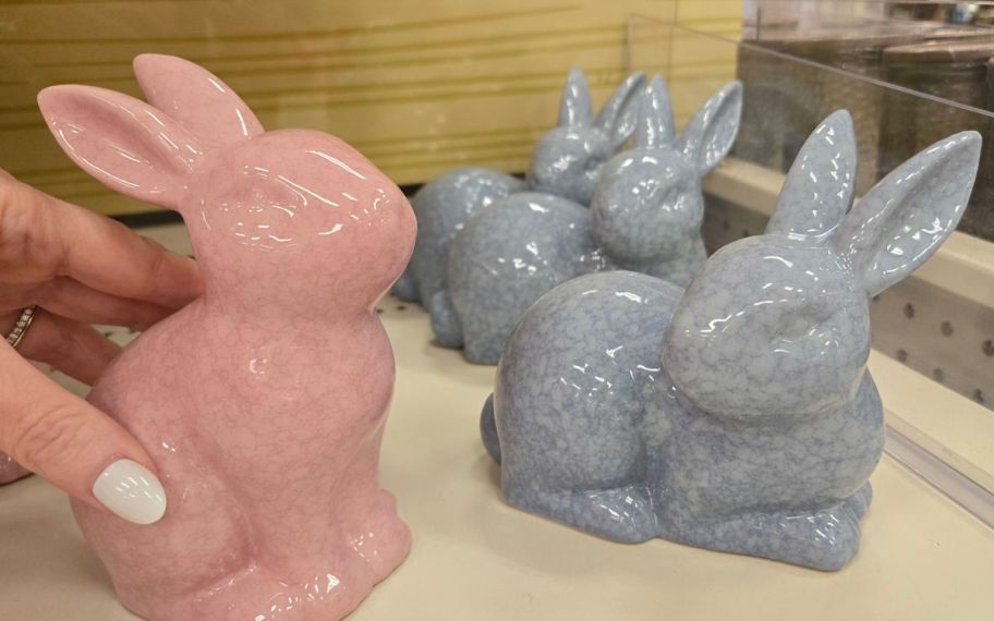 hand holding Ceramic color bunnies