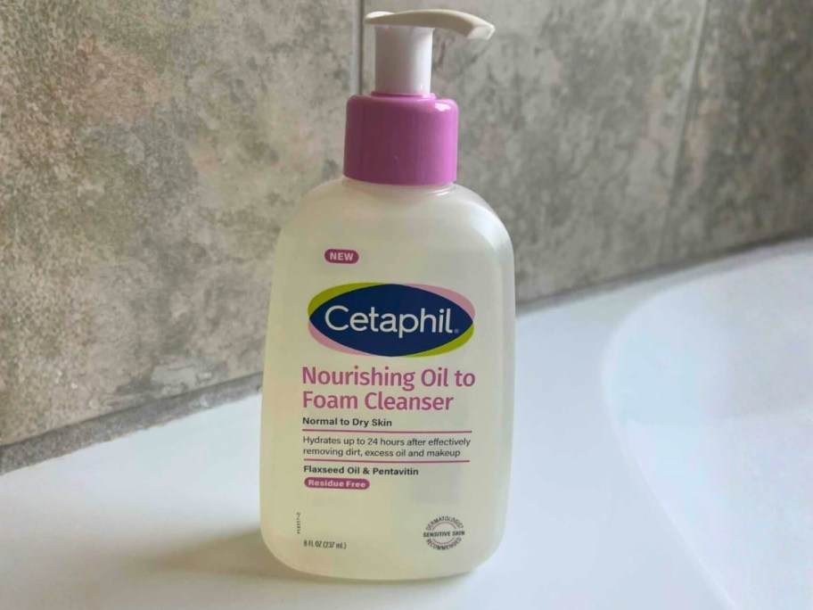 cetaphil nourishing oil to foam facial cleanser bottle on bathroom counter