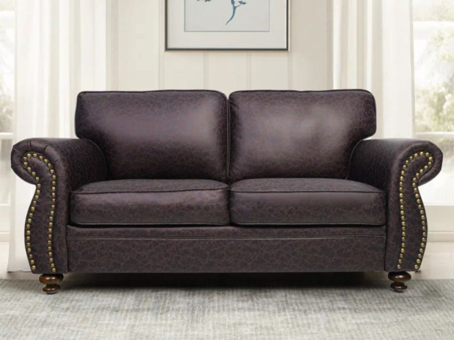 Charlton Home Faux Leather Loveseat Rolled Arm Sofa in living room