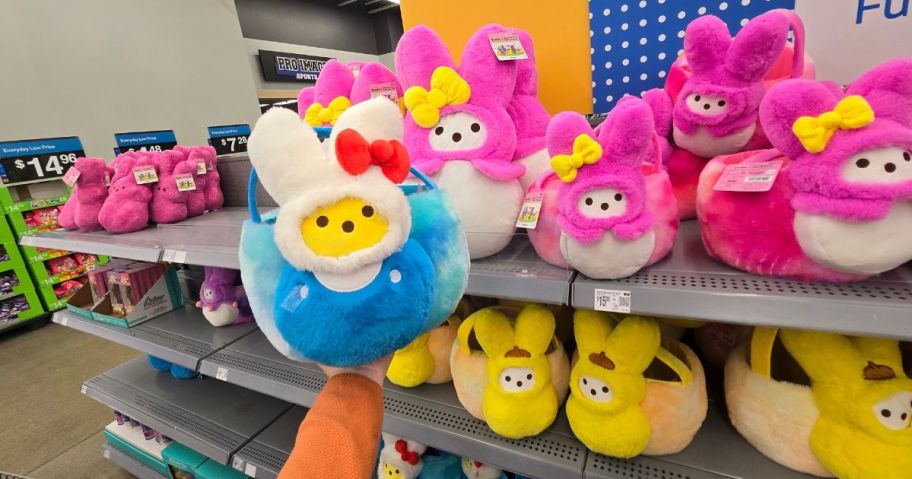 A person holding a Hello Kitty x Peeps Plush Easter Baskets at Walmart