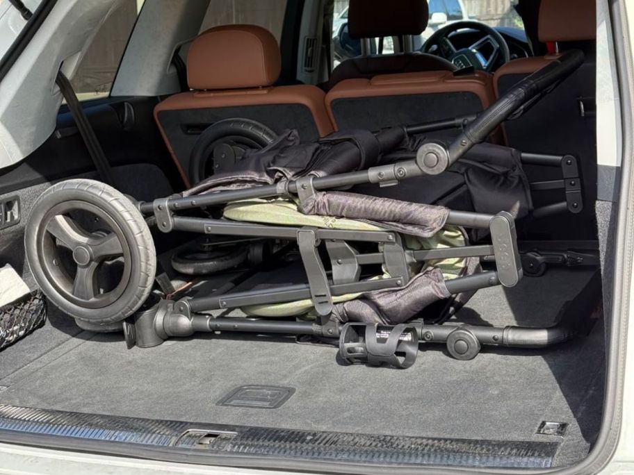 A folded jeep wagon in a trunk