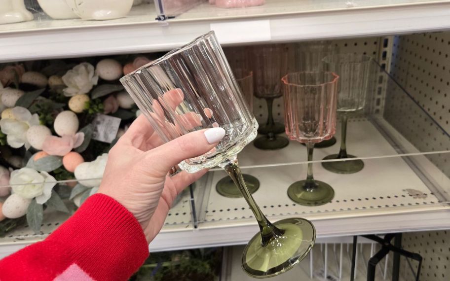 hand holding stemware