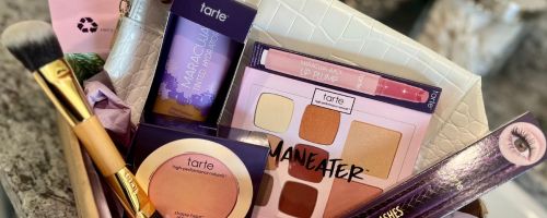 A box filled with Tarte cosmetics