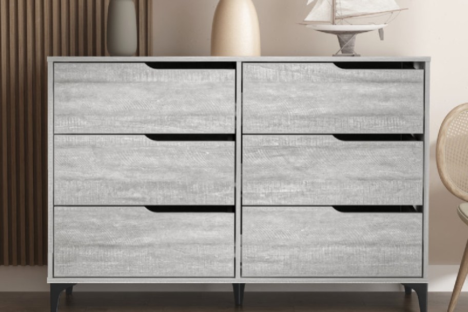 The Twillery Co. Norcross 6 Drawer 46.5'' W Double Dresser in gray displayed in a room