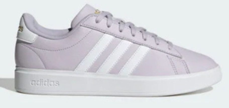 light purple and white striped adidas Women's Grand Court Cloudfoam Lifestyle Court Comfort Shoe stock image