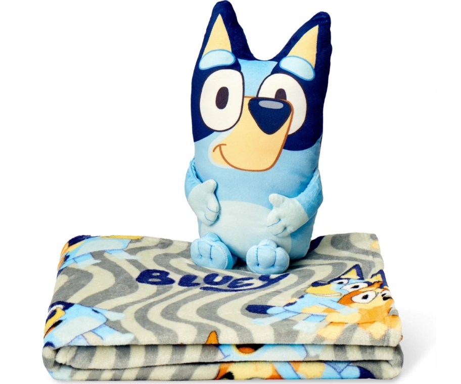 a bluey plush toy on a folded blanket