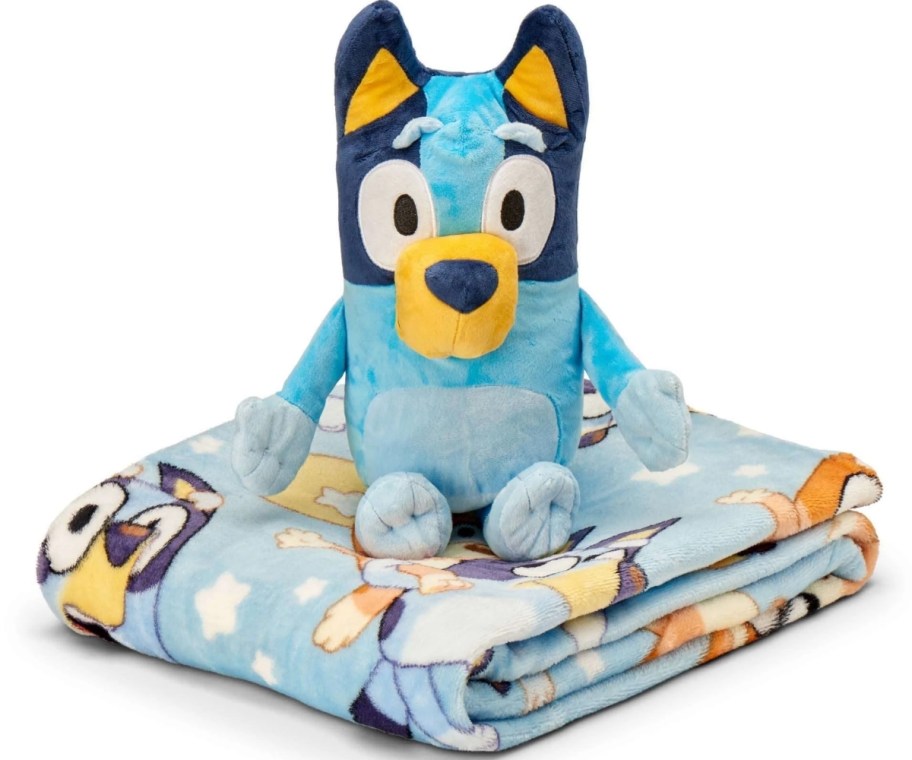 a bluey plush toy on a folded blanket