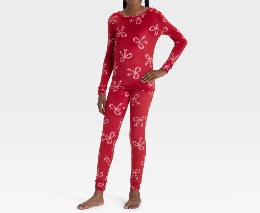 girl modeling red bow long sleeve and pants pajamas