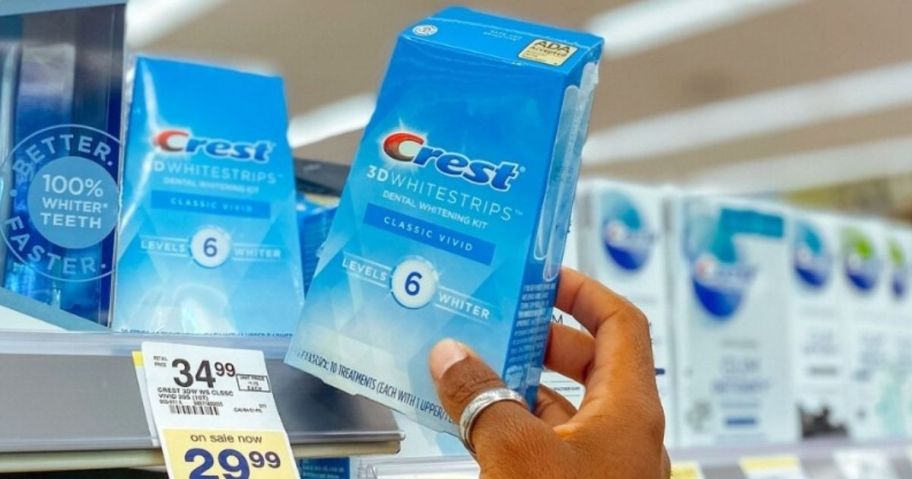 crest whitening strips box in hand in store