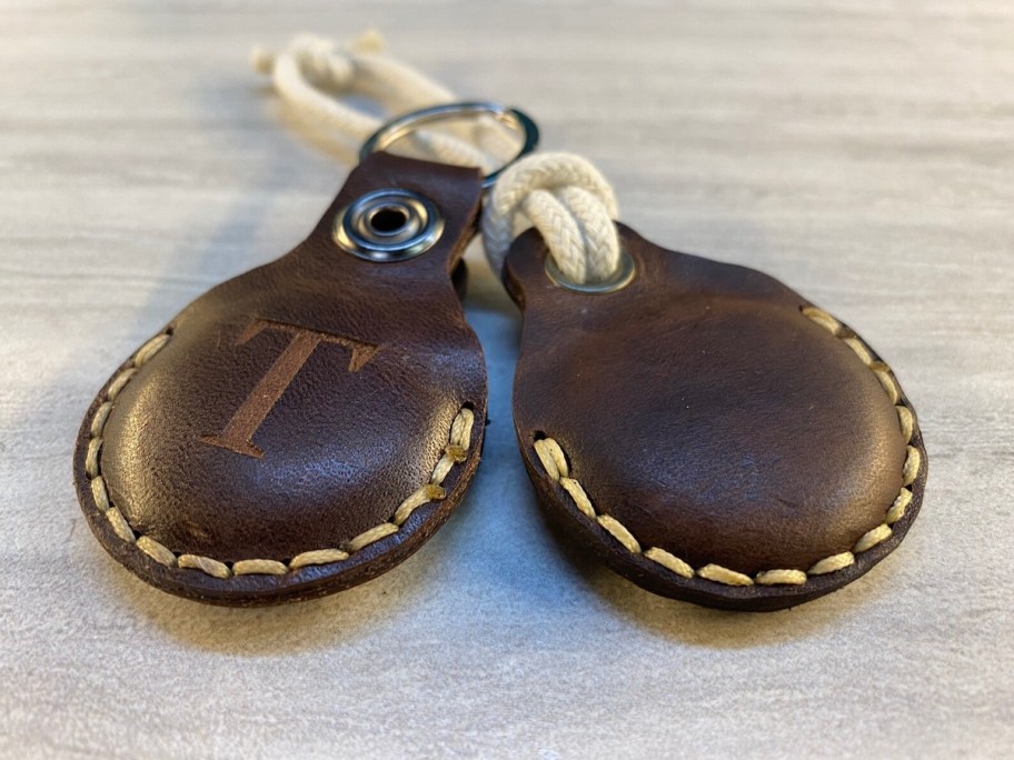 dark brown keychain holder with monogram on top