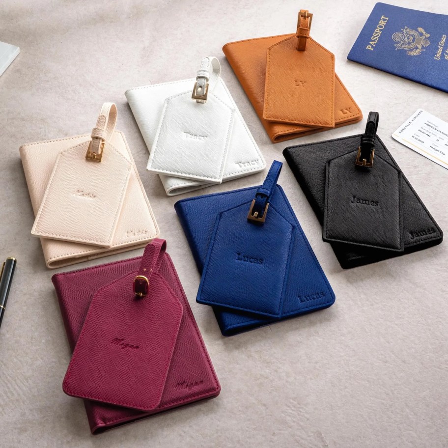 custom passport holders with luggage tags on table