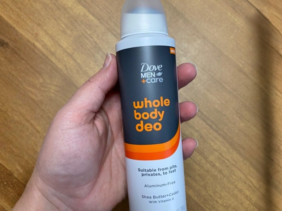 hand holding a can of Dove Men+Care Whole Body Aluminum-Free Deodorant Spray
