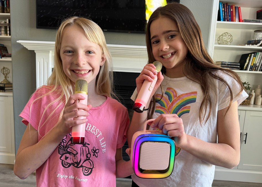 two girls with a karaoke machine