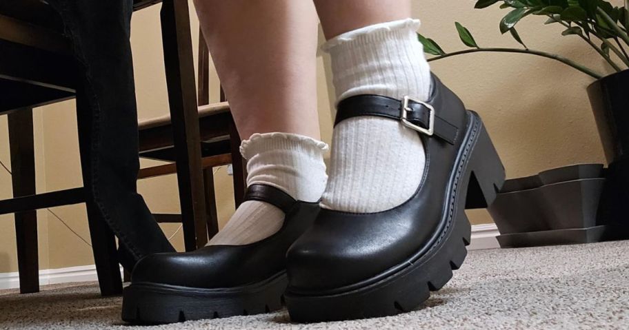 girl wearing Mary Janes with socks in dining room