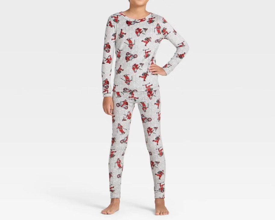 boy modeling santa pajamas