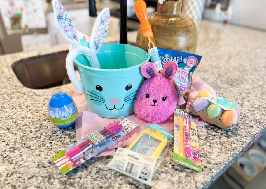 blue bunny basket with easter chalk, bubbles, plush, markers, and more 