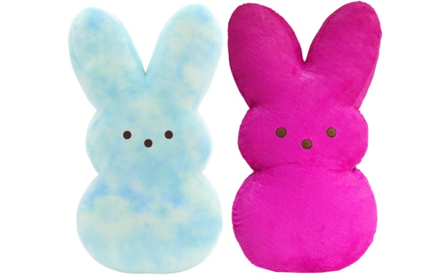 Two jumbo Peeps plush bunny-shaped toys with simple facial features. One is light blue with a cloud-like pattern, and the other is bright pink.