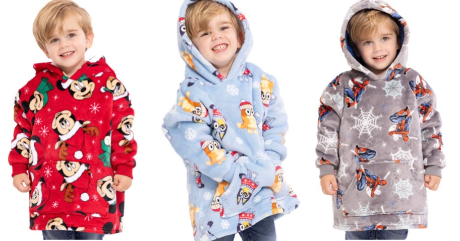 three boys wearing mickey mouse, bluey, and spiderman hoodies